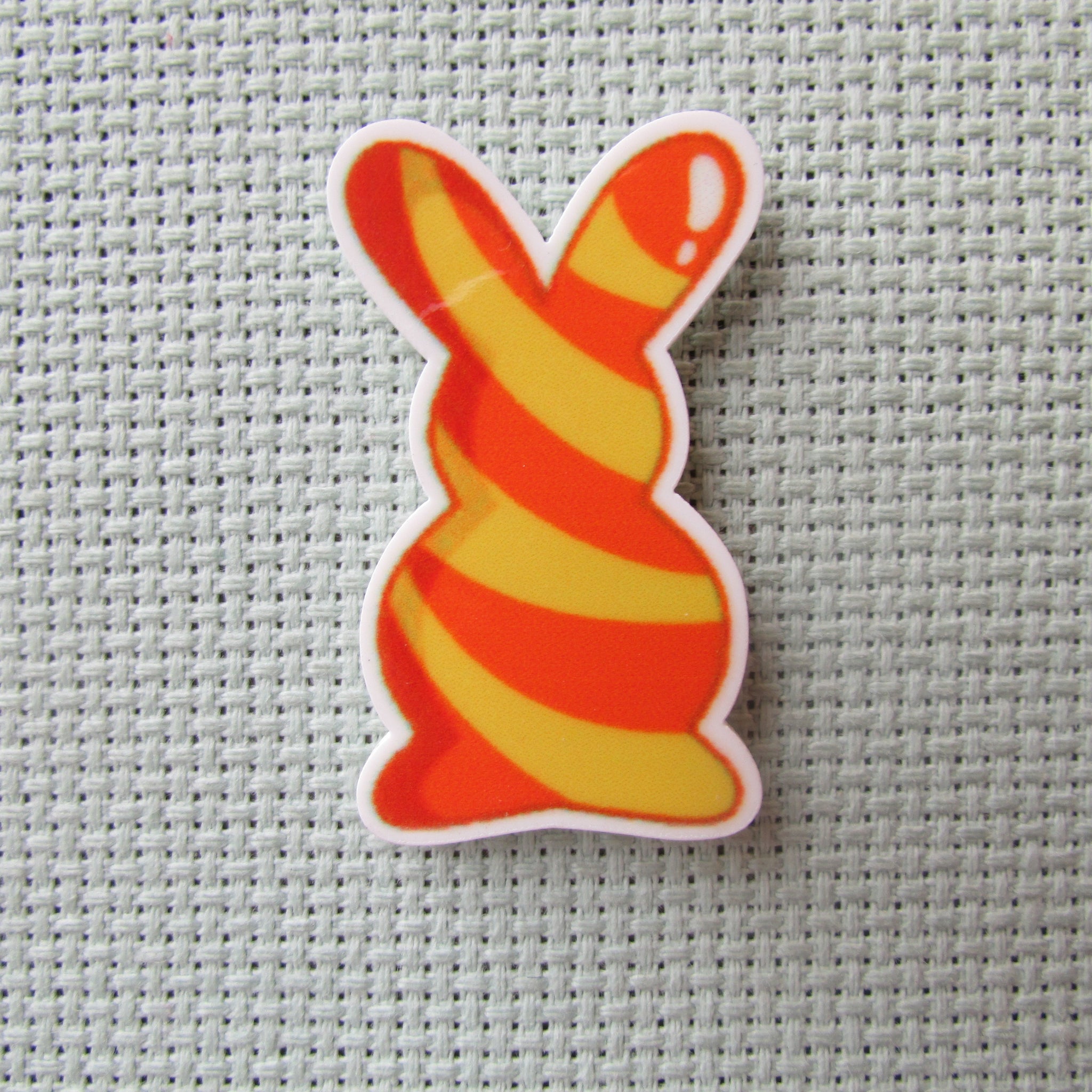 First view of the Yellow and Orange Swirl Bunny Needle Minder