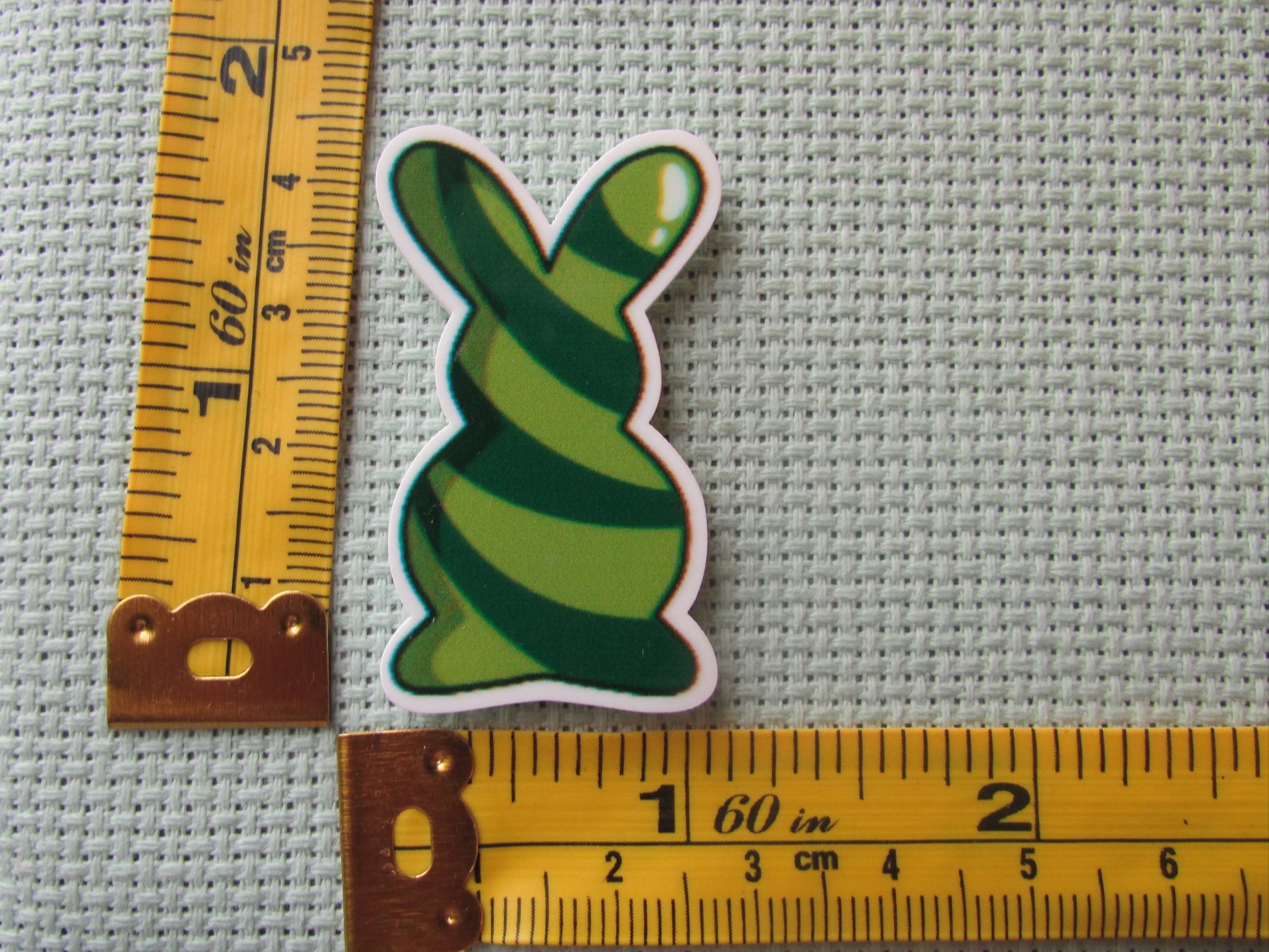 Third view of the Green Swirl Bunny Needle Minder