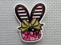 First view of the Black and White Stripped Floral Bunny Head Needle Minder