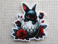 First view of Black Easter Bunny in an Eggshell Needle Minder.
