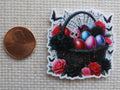 Second view of a black Easter basket covered in spider webs with black butterflies and black and red roses.