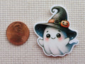 Second view of Cute ghost wearing a black witches hat with a tiny carved pumpkin on the brim minder.